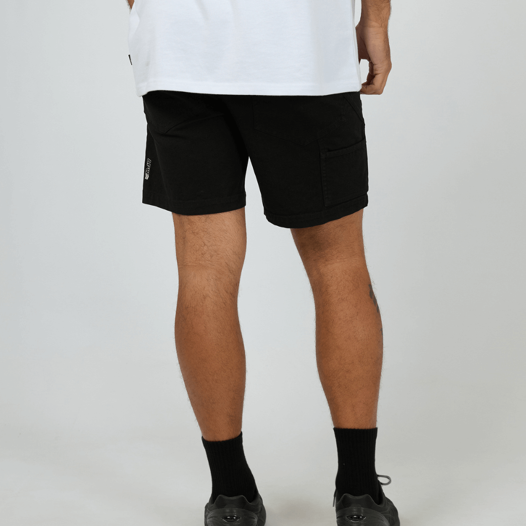 Goliath APW Enduro Short available at Stewart’s Menswear Mullumbimby. Men’s all-purpose cotton-stretch utility shorts built for work, camping, and fishing. Photo shows back view, colour is black.