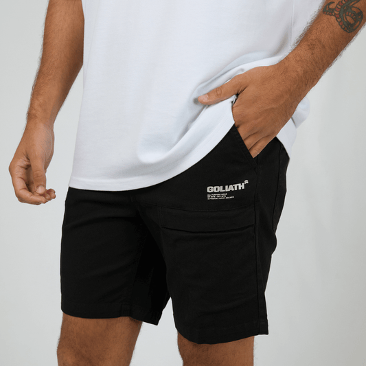 Goliath APW Enduro Short available at Stewart’s Menswear Mullumbimby. Men’s all-purpose cotton-stretch utility shorts built for work, camping, and fishing. Photo shows close up view, colour is black.