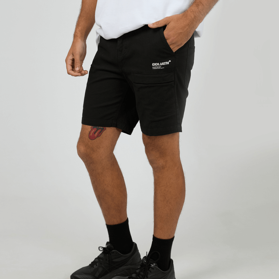 Goliath APW Enduro Short available at Stewart’s Menswear Mullumbimby. Men’s all-purpose cotton-stretch utility shorts built for work, camping, and fishing. Photo shows front view, colour is black.