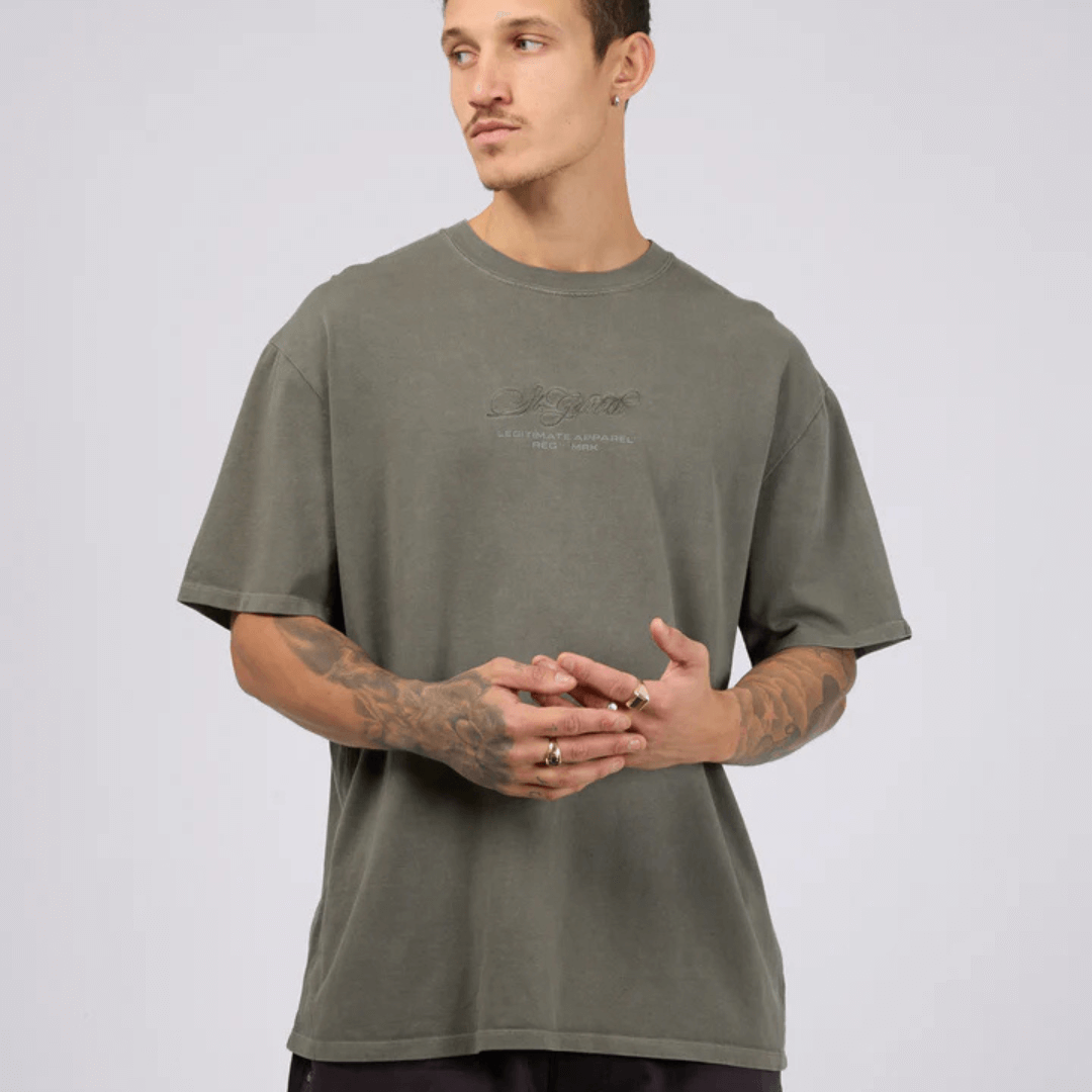 Model wearing St Goliath Arching tee available from Stewarts Menswear in Mullumbimby.