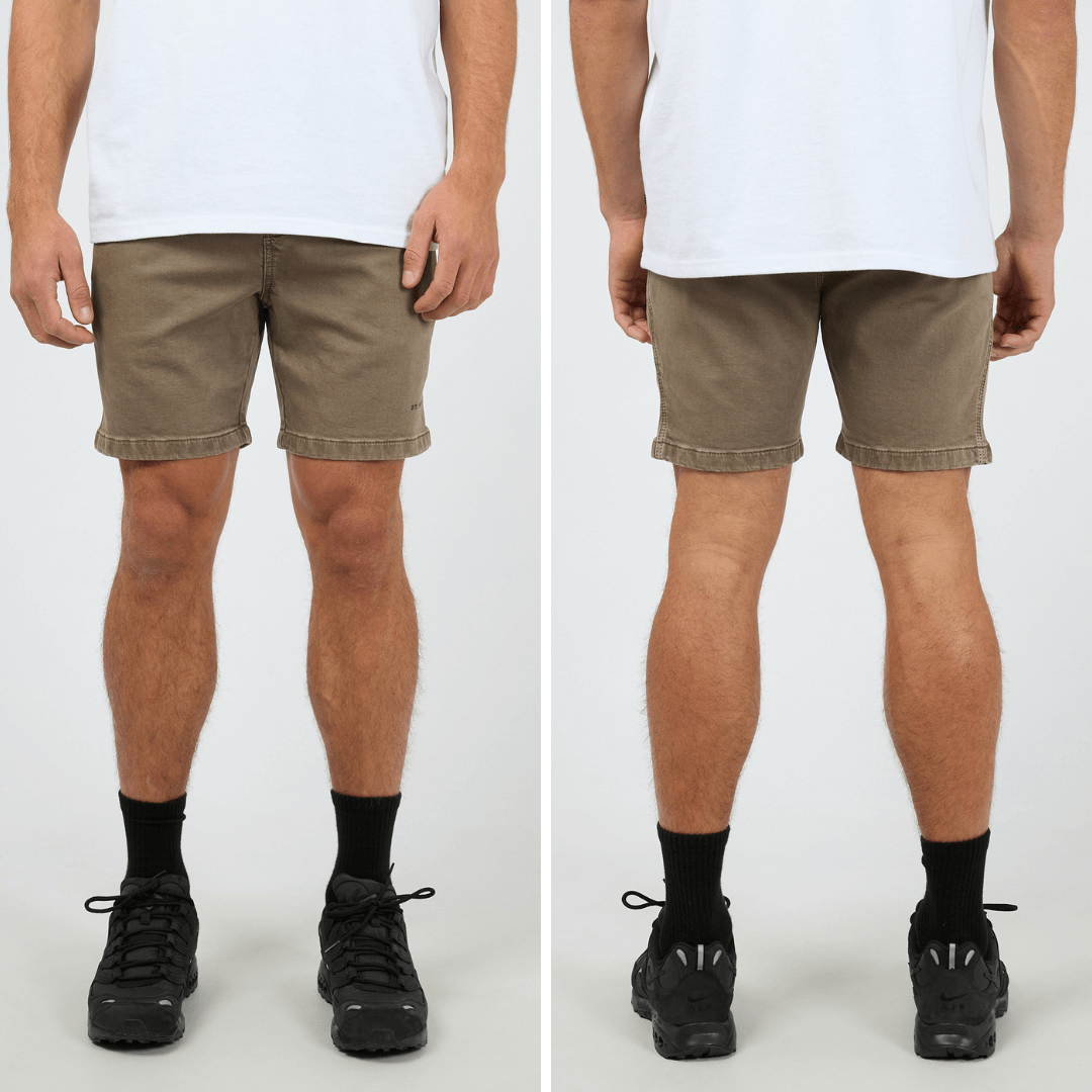 Stewart's Menswear, Mullumbimby. Front and back views of model wearing St Goliath Fairhaven short in Nut colour. St. Goliath logo on leg.