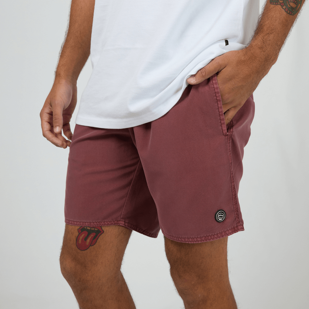 St Goliath Illusion Short available at Stewart's Menswear in Mullumbimby. Photo shows model wearing Burgundy colour St Goliath Illusion Shorts.