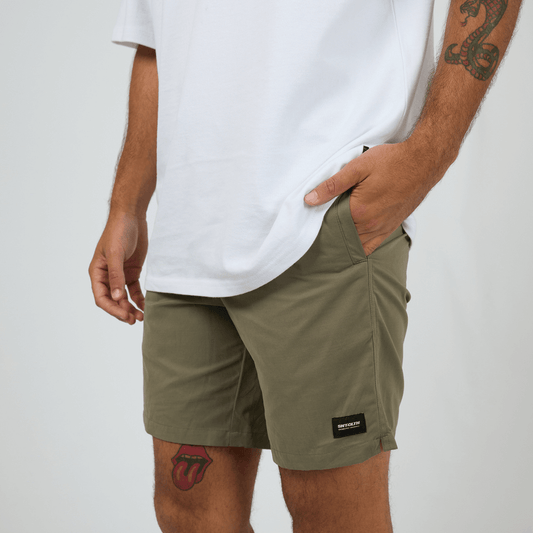 St Goliath Swim Volley Short available at Stewart’s Menswear Mullumbimby. Men’s modern fit swim short with stretch nylon, Velcro back pocket, and branded patch. PHoto shows front view, colour is Olive