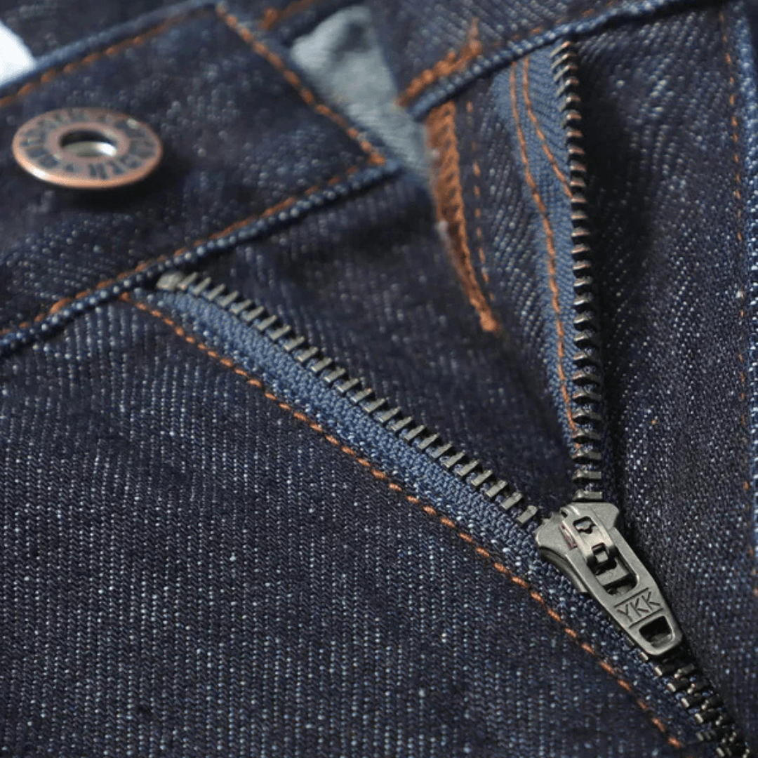 Close up photo of YKK zipper on Outback Supply Co Fusion Cargo Short in mid-weight denim with cargo pockets and YKK zip, available at Stewart's Menswear Mullumbimby.