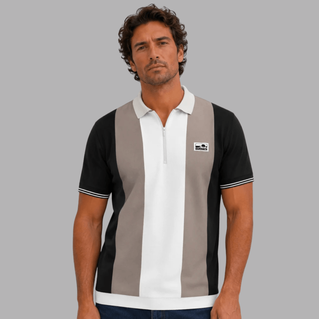 Man wearing Outback Supply Co black, taupe, and white colour-blocked polo shirt with quarter-zip neckline, available at Stewart's Menswear Mullumbimby.