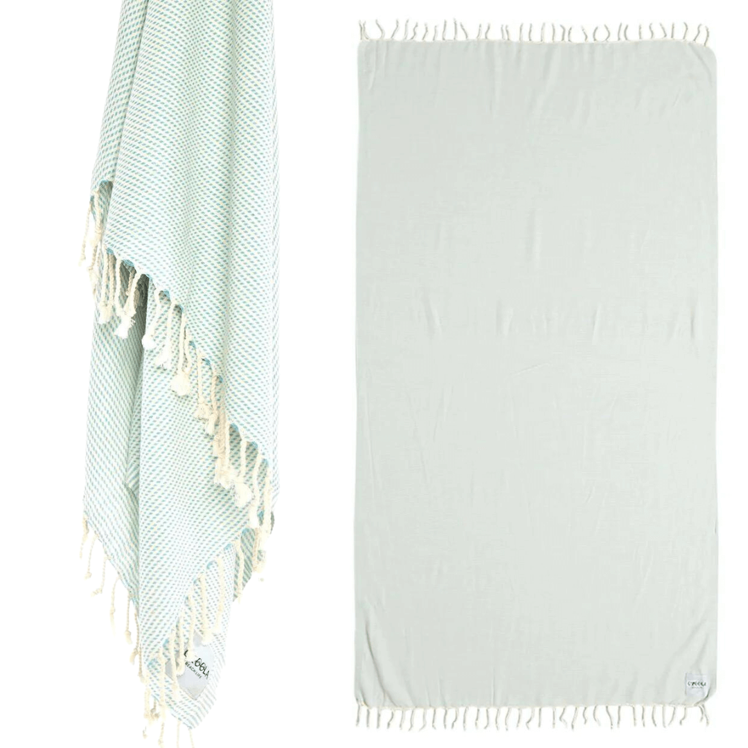 Stewarts Menswear Ozoola Original Beach Towel. The Original Ozoola Towel is made from 100% Turkish Cotton which is super absorbent and fast drying.  Sized at 180 x 100cm with knotted fringing at each end. Ideal for endless beach days, and lazy pool days.  Soft and light, it is perfect for travelling and it can also be used as a sarong.  Colour is MInt.