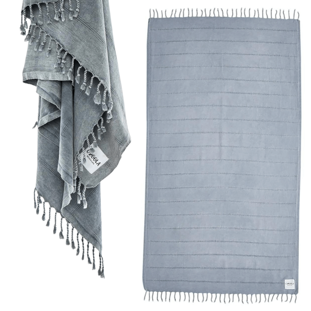 Stewarts Menswear Ozoola Stonewash Towel. The Ozoola Stonewash Towel is made from 100% Turkish Cotton which is super absorbent and extremely fast drying.  Made with a stylish stonewash technique to give it its unique look, it is the most premium of the range. Colour is Grey.