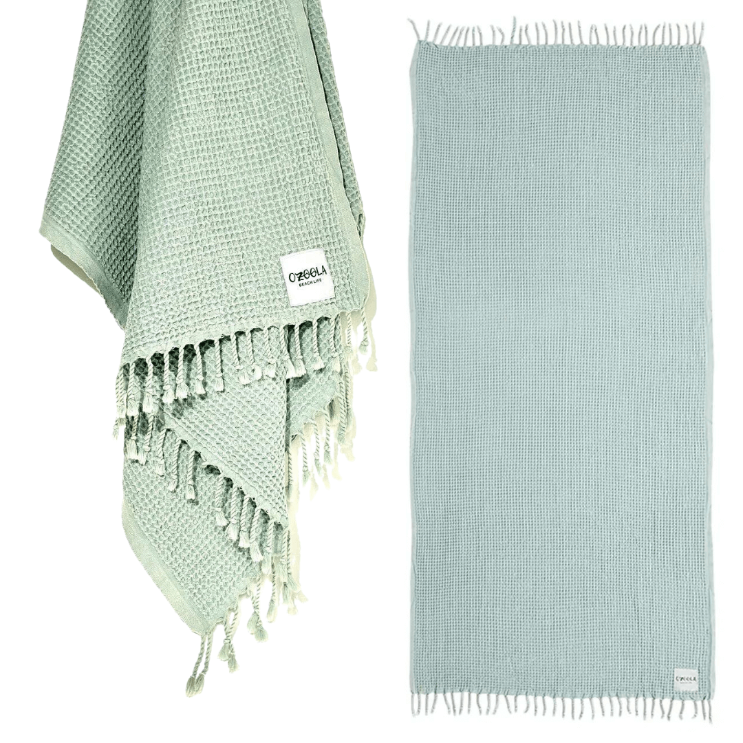 Stewarts Menswear Ozoola Waffle Beach Towel. The Ozoola Waffle Beach Towel is made from 100% Turkish Cotton which is super absorbent and extremely fast drying.  Sized at 170 x 185cm with knotted fringing at each end. Colour is Mint.