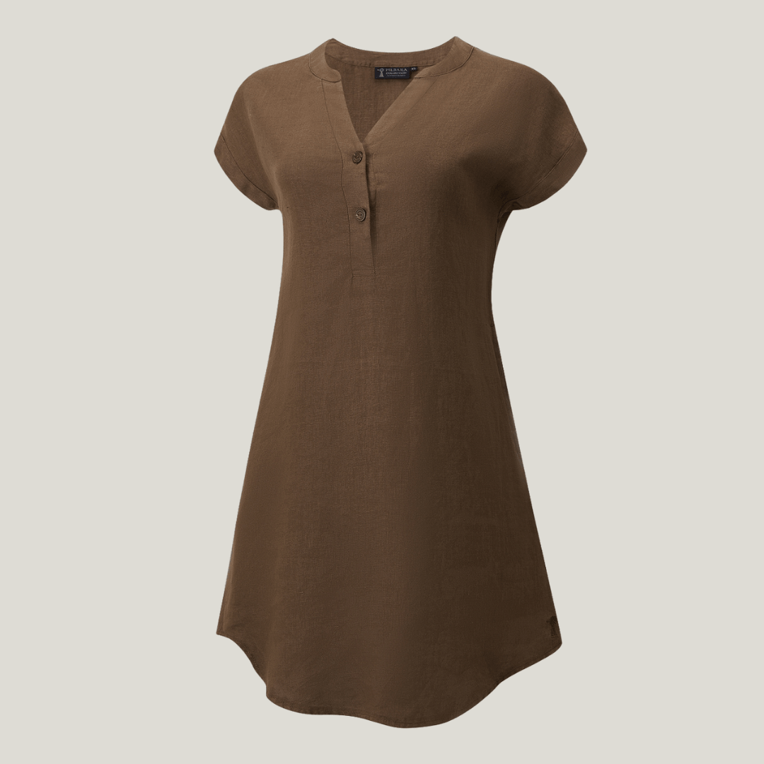 Female model wearing Ritemate Pilbara Alina Cap Sleeved Linen Dress in Cocoa, 100% linen dress with side pockets available at Stewart's Menswear Mullumbimby.