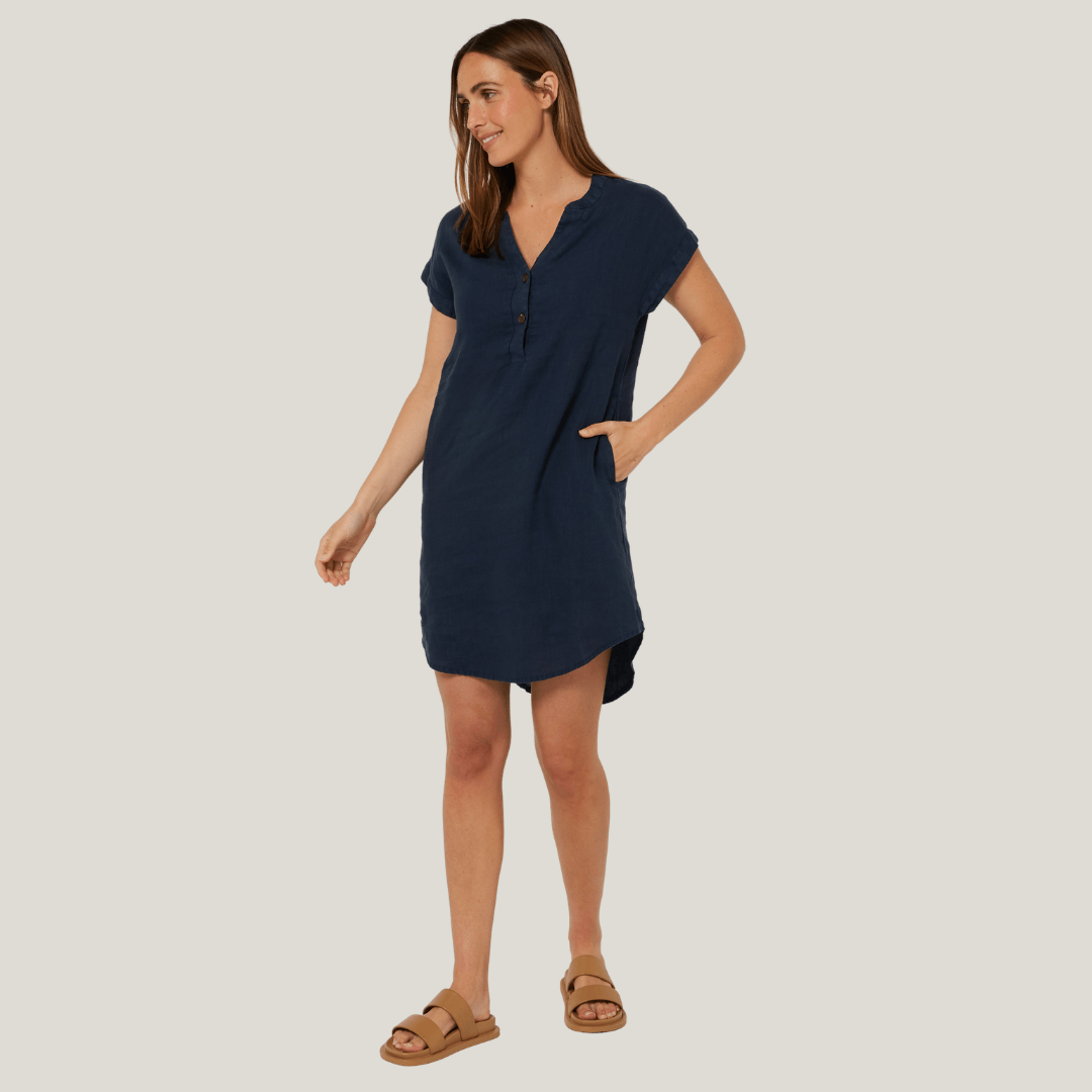 Female model wearing Ritemate Pilbara Alina Cap Sleeved Linen Dress in Navy, 100% linen dress with side pockets available at Stewart's Menswear Mullumbimby.