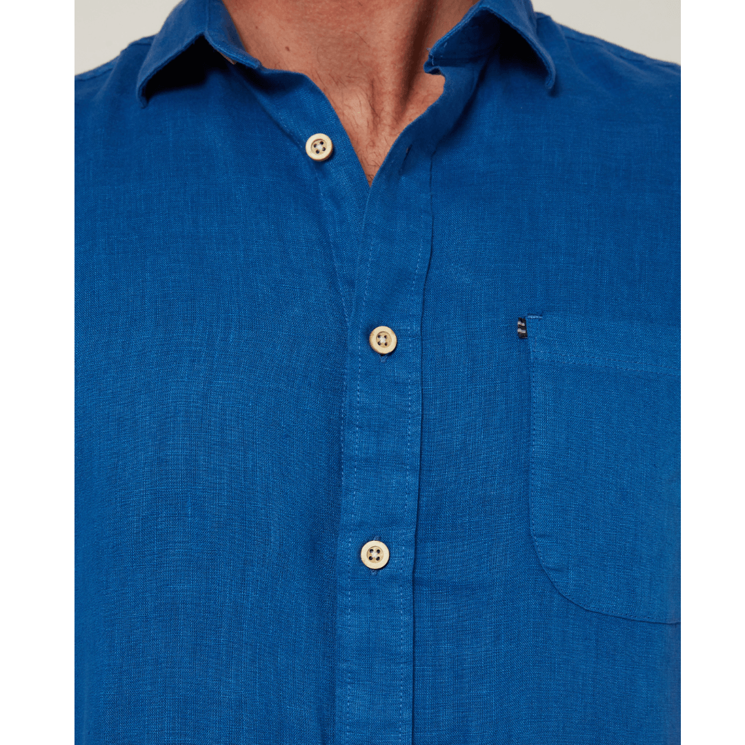Close up view of men's Pilbara Collection by Ritemate Workwear Classic Fit Short Sleeve Linen Shirt in deep blue with Windmill embroidery detail, available at Stewart's Menswear Mullumbimby.