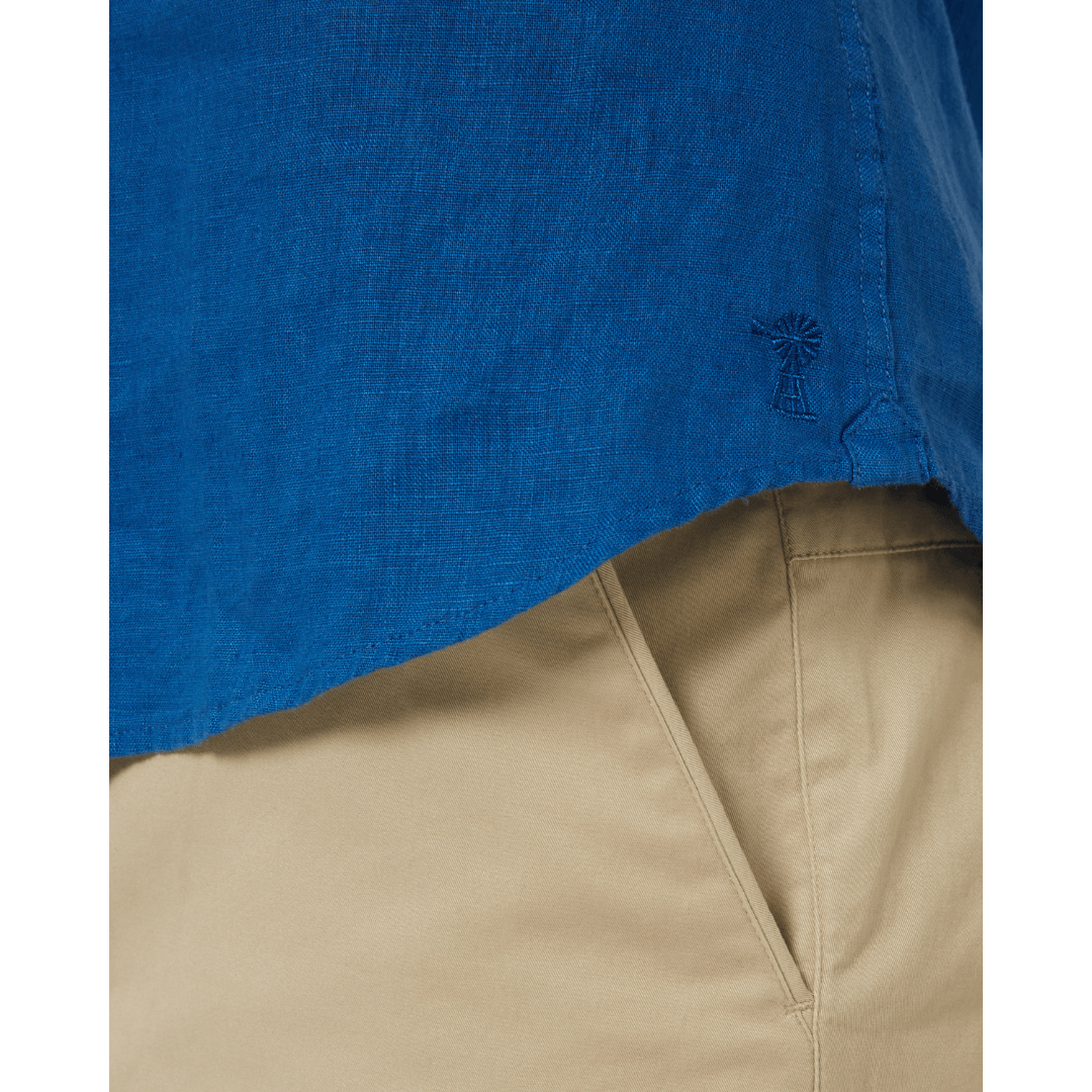 Close up View of men's Pilbara Collection by Ritemate Workwear Classic Fit Short Sleeve Linen Shirt in deep blue with Windmill embroidery detail, available at Stewart's Menswear Mullumbimby.
