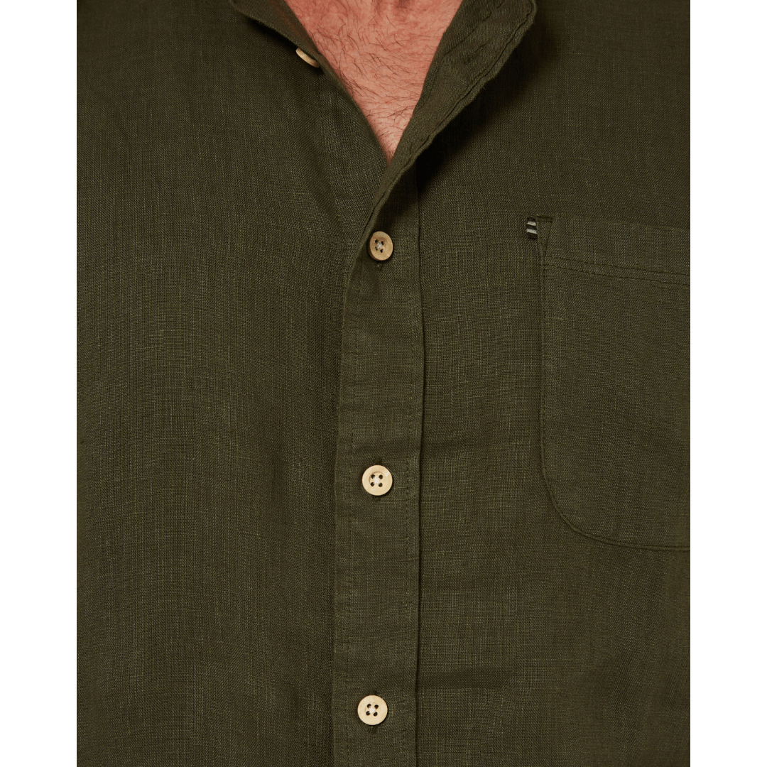 Close up view of Men's Pilbara Collection by Ritemate Workwear Classic Fit Short Sleeve Linen Shirt in Olive with Windmill embroidery detail, available at Stewart's Menswear Mullumbimby.