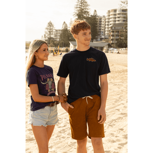 Lifestyle photo of men's Pilbara Collection by Ritemate Workwear Corduroy Shorts in maple with Windmill embroidery detail, available at Stewart's Menswear Mullumbimby.
