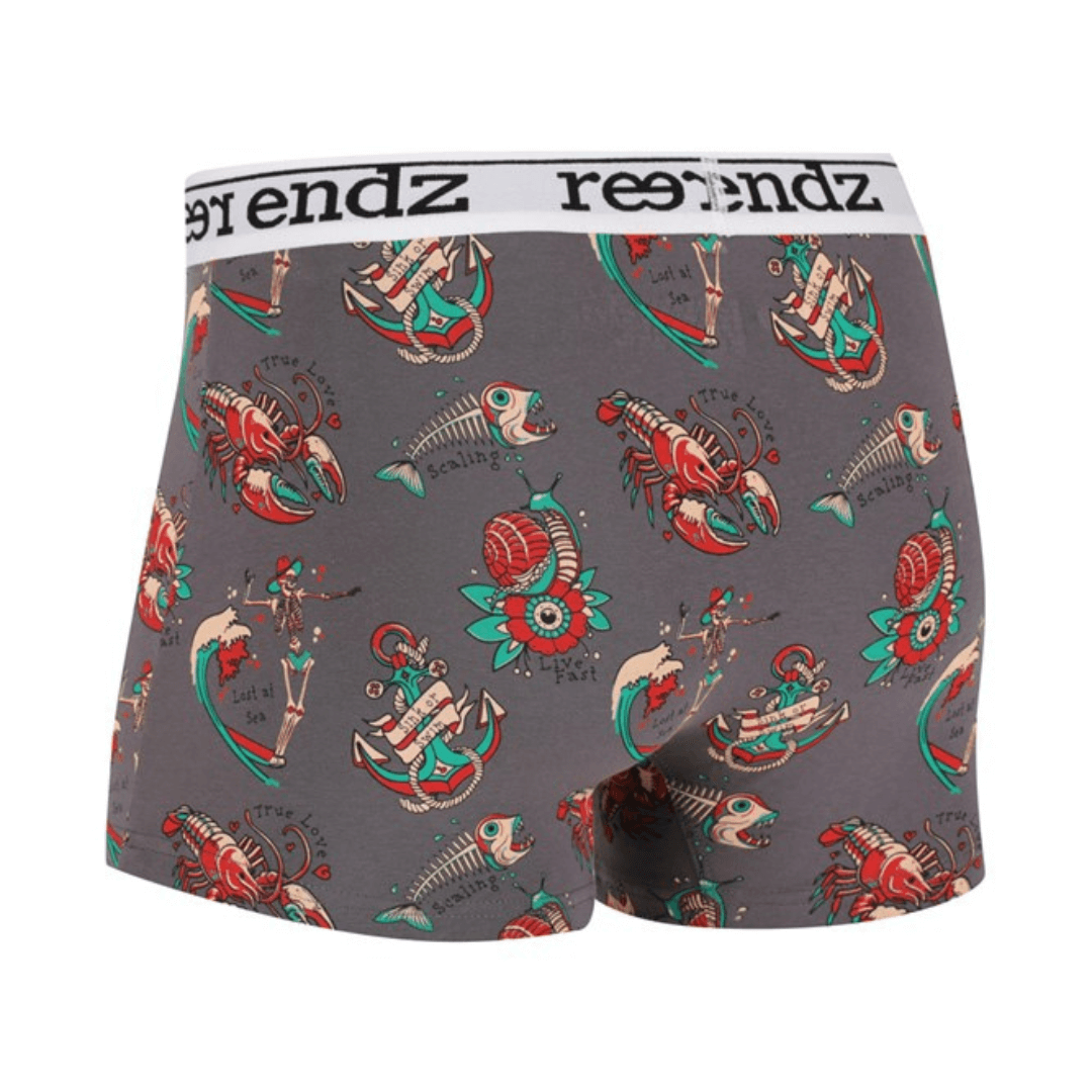 Reer Endz Organic Cotton Trunks Skin to Threads available at Stewart’s Menswear Mullumbimby. Soft organic cotton men’s underwear with waistband and fly front. Charcoal trunks with tattoo inspired pattern printed all over, back view.