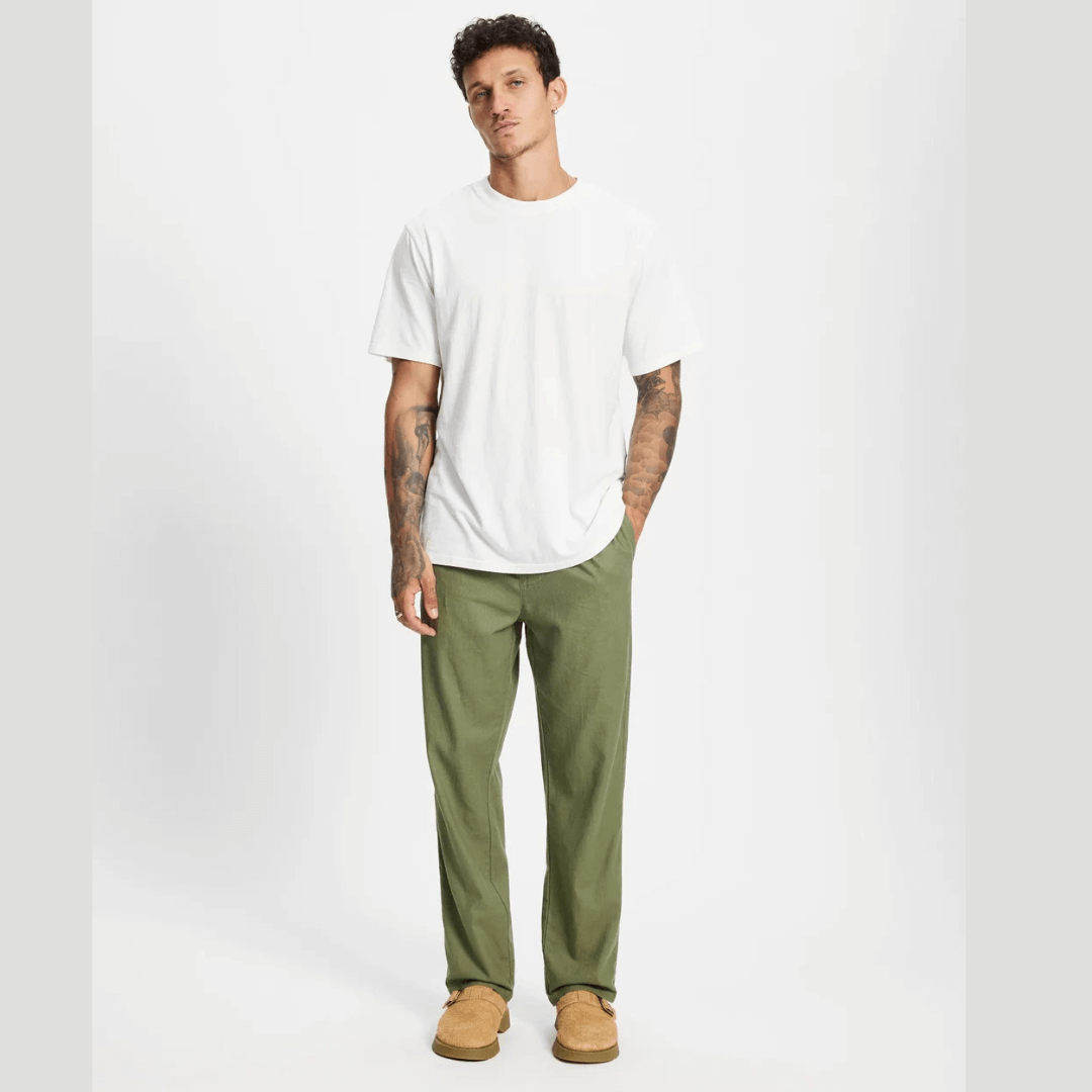 Model wearing Rhythm Linen Jam pant with a white t-shirt available from Stewart's Menswear in Mullumbimby.