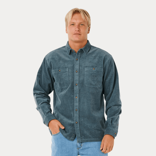 Front View of model wearing Rip Curl Premium Cord Long Sleeve Shirt Pine Night available at Stewart’s Menswear Mullumbimby. 100% cotton garment-washed cord shirt with chest pocket.