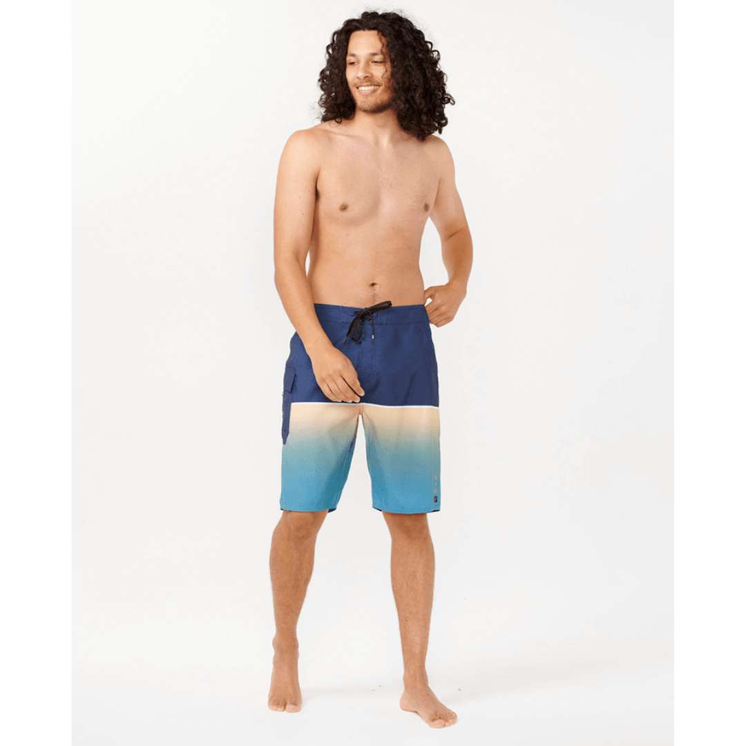 Stewart's Menswear Rip Curl Dawn Patrol Boardshorts. Navy top half with gradient blue bottom half. Photo shows front view of model wearing Rip Curl Dawn Patrol boardshorts. Colour is called Ocean.