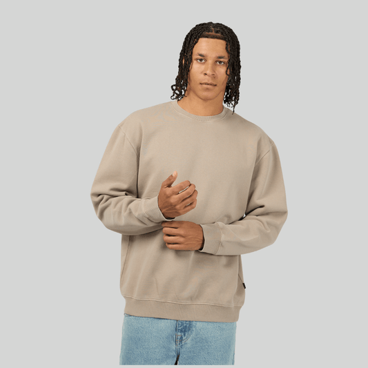 Front view of man wearing a beige sweatshirt against a plain background. Silent Theory Box Crew fleece sweatshirt available at Stewart’s Menswear Mullumbimby.