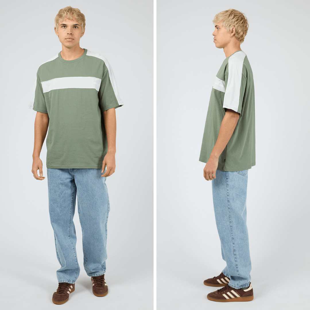 front and side views of Silent Theory Cutback Panelled Tee in eucalyptus green, regular-fit men's cotton tee with panel detailing, available at Stewart's Menswear Mullumbimby.
