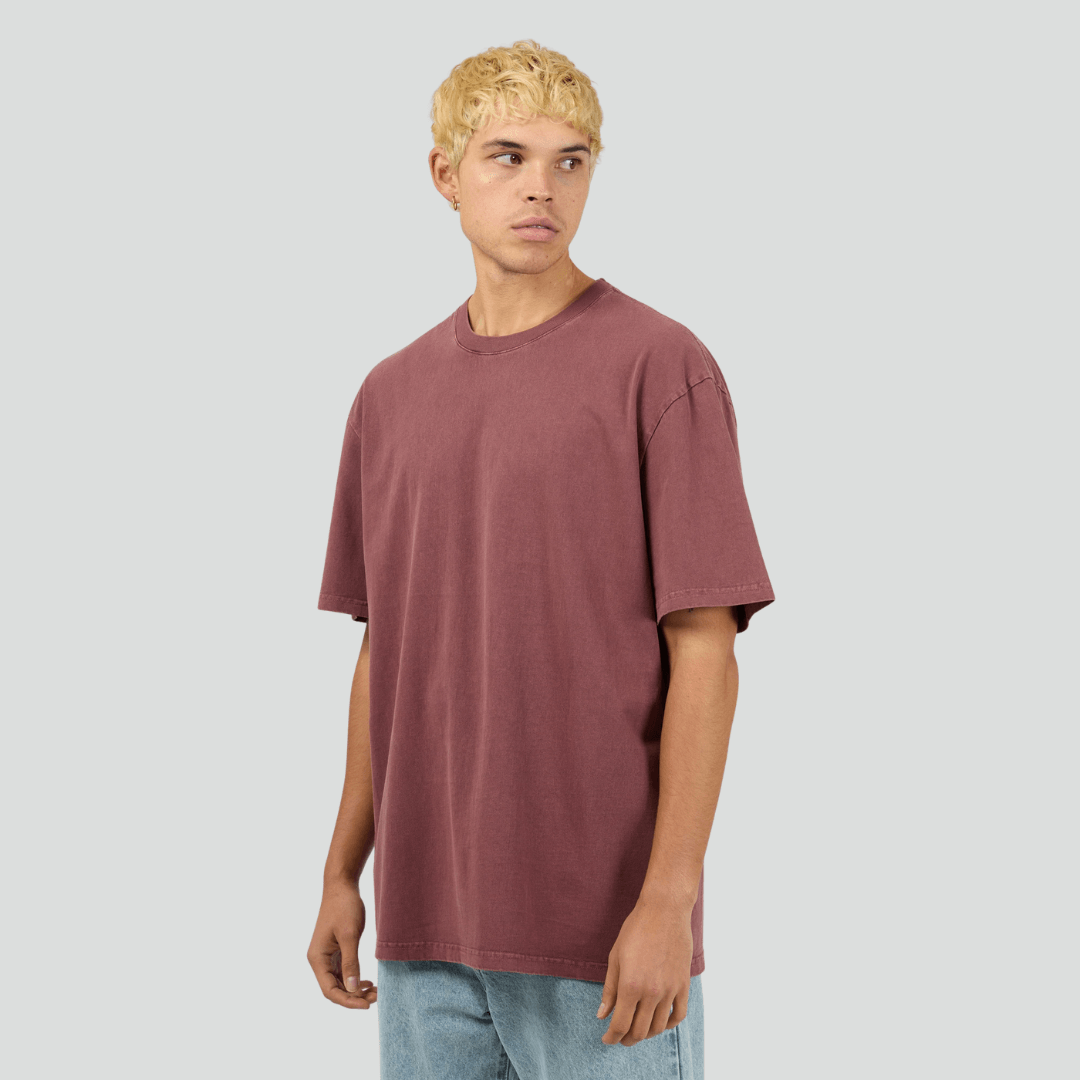 Front view of model wearing burgundy Silent Theory Essential Tee available at Stewart’s Menswear Mullumbimby. Men’s relaxed fit 100% cotton tee with crew neck and short sleeves.