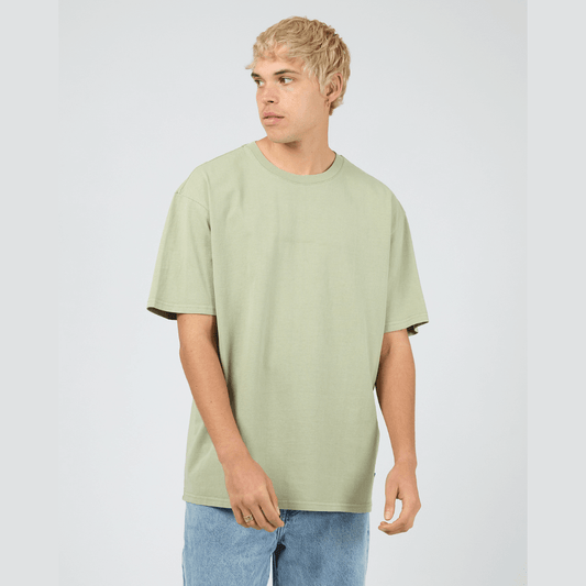 Front view of model wearing mint Silent Theory Essential Tee available at Stewart’s Menswear Mullumbimby. Men’s relaxed fit 100% cotton tee with crew neck and short sleeves.