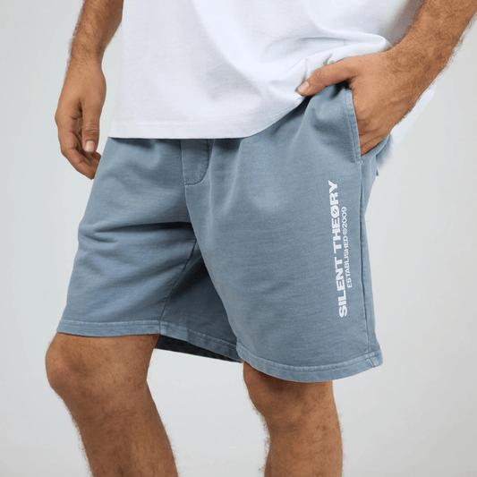 Front View of model wearing Silent Theory Essential Theory Short V2 available at Stewart’s Menswear Mullumbimby. Men’s unbrushed French terry cotton shorts with elastic waist and pockets. Light Blue.