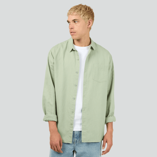 Silent Theory Long Sleeve Linen Shirt in relaxed sage linen with collared neckline and front pocket, available at Stewart's Menswear Mullumbimby.