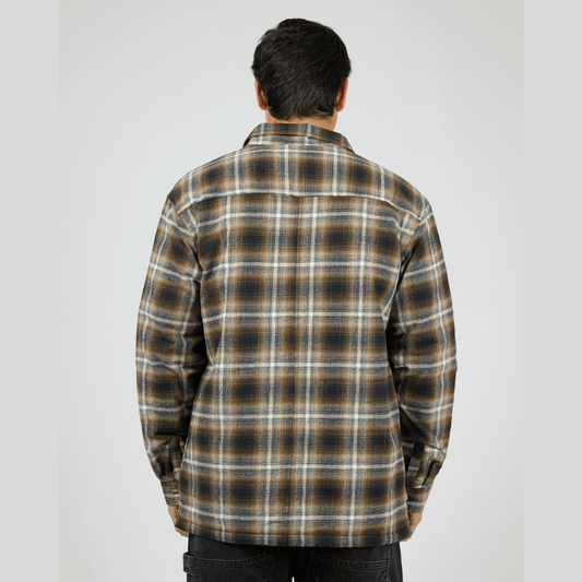 Back view of model wearing St Goliath Floyd Shacket available at Stewart’s Menswear Mullumbimby. 100% cotton brushed check (navy, brown, white) shacket with quilted lining and zip-up front.