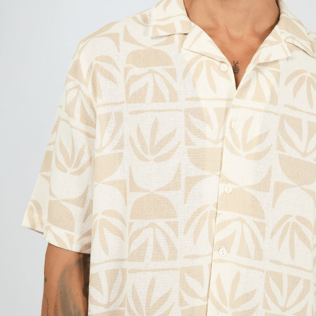 Close up view of St Goliath Hour Glass Short Sleeve Shirt in cream with sand geometric print and open collar, available at Stewart's Menswear Mullumbimby.