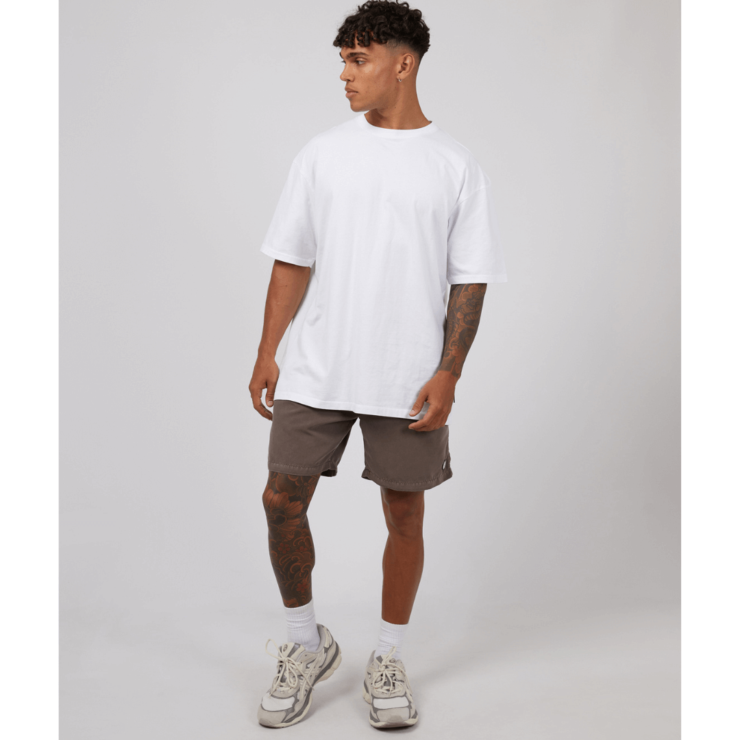 Stewarts Menswear St Goliath Illusion short. Made from 100% recycled material, Its faded look adds a touch of trendiness while the quick dry micro fibre material ensures comfort. Colour is Taupe. Image shows front view of model wearing St Goliath Illusion shorts.