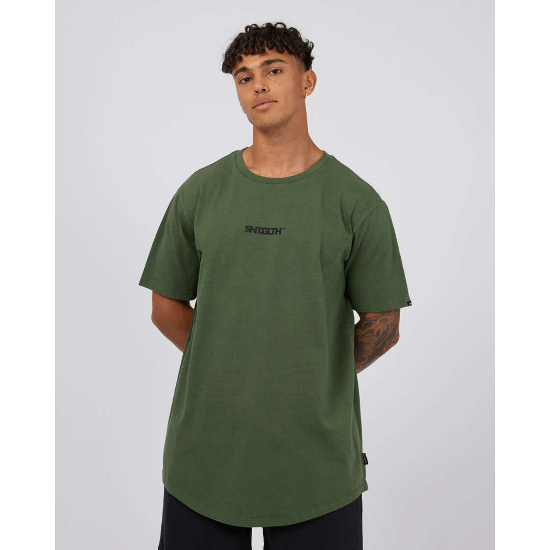 Stewarts Menswear St Goliath Overwrite Tee. A relaxed fit, oversize tee with large St Goliath print on back with smaller front chest print. Photo shows front view of model wearing St Goliath Overwrite Tee.