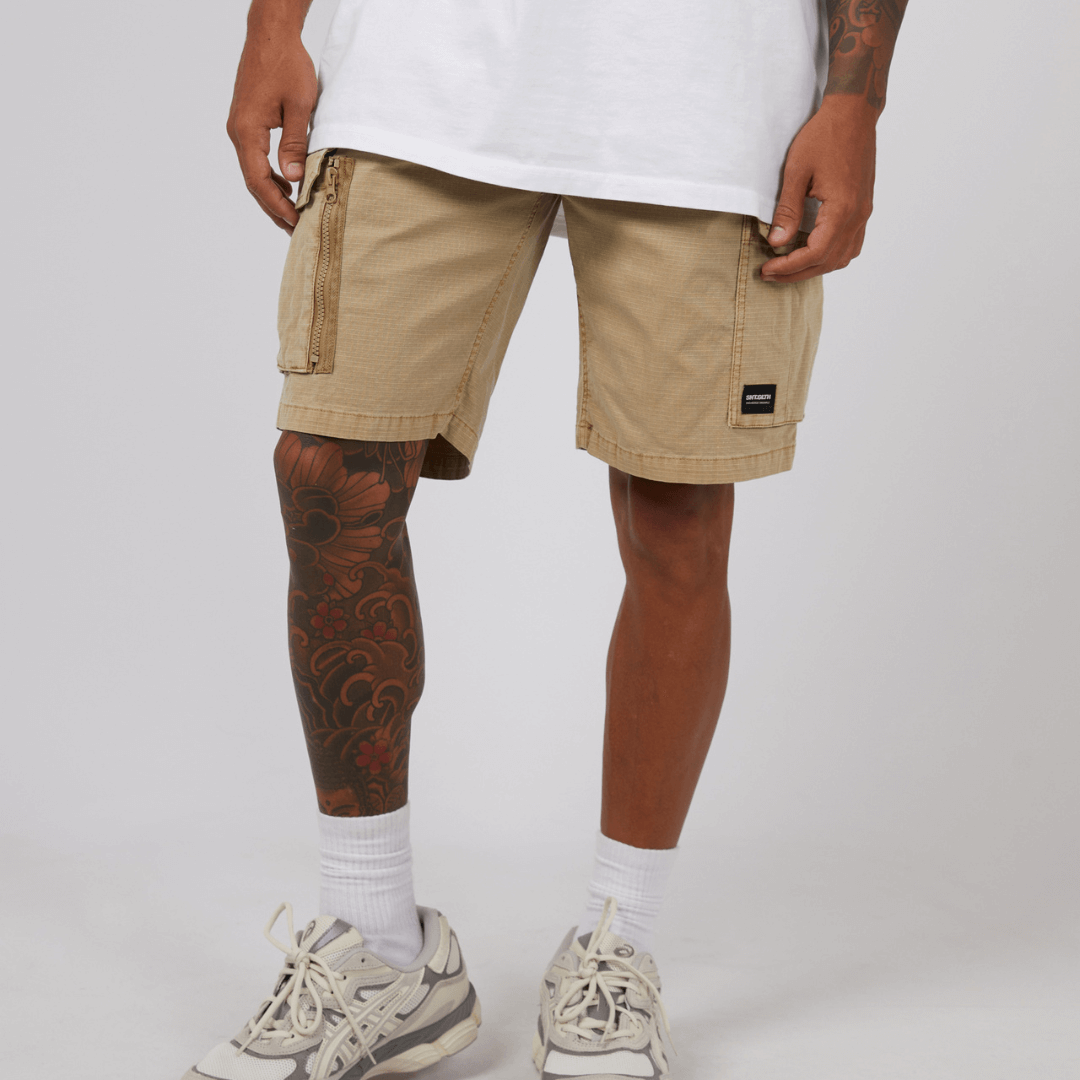 stewarts Menswear St Goliath Ripstop Cargo Short. Colour is sand. Photo shows front view of model wearing St Goliath Ripstop Cargo Short.