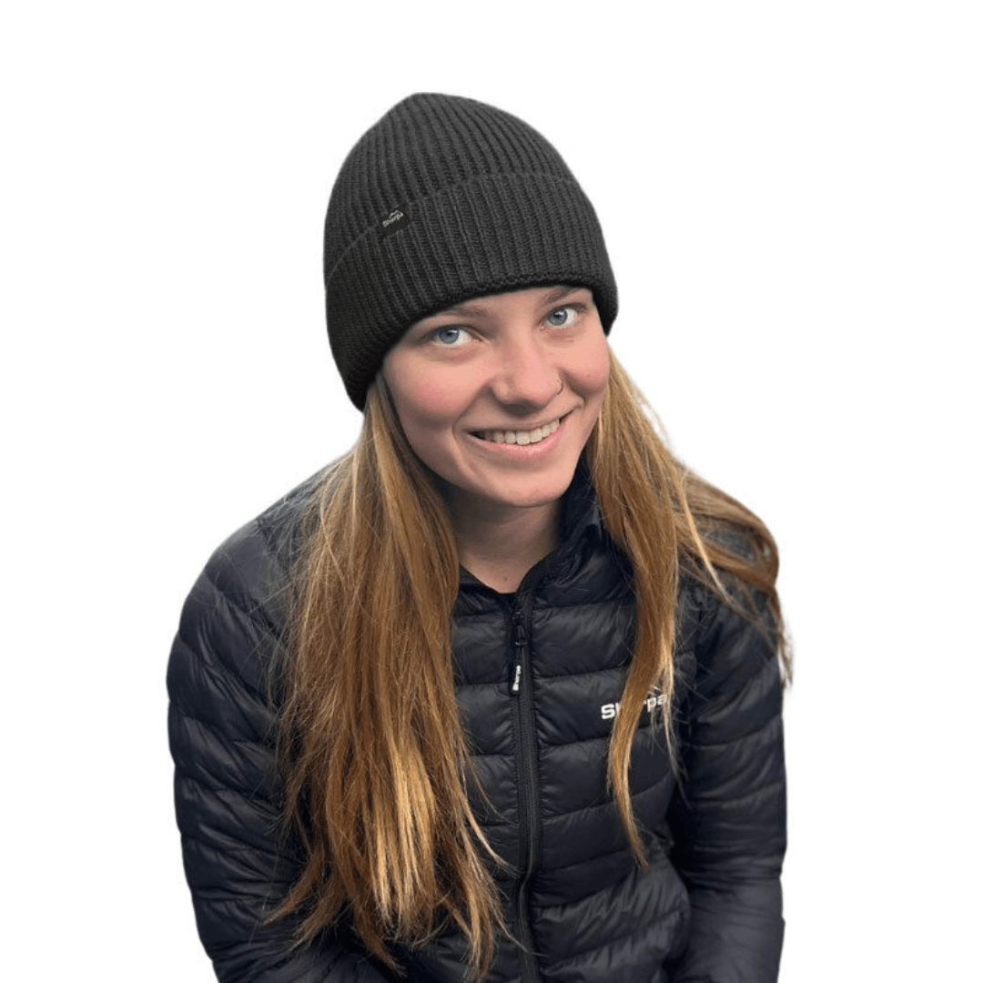 Model Wearing black Sherpa Temba Beanie in 100% Australian merino wool with fold-up knit design, available at Stewart's Menswear Mullumbimby.