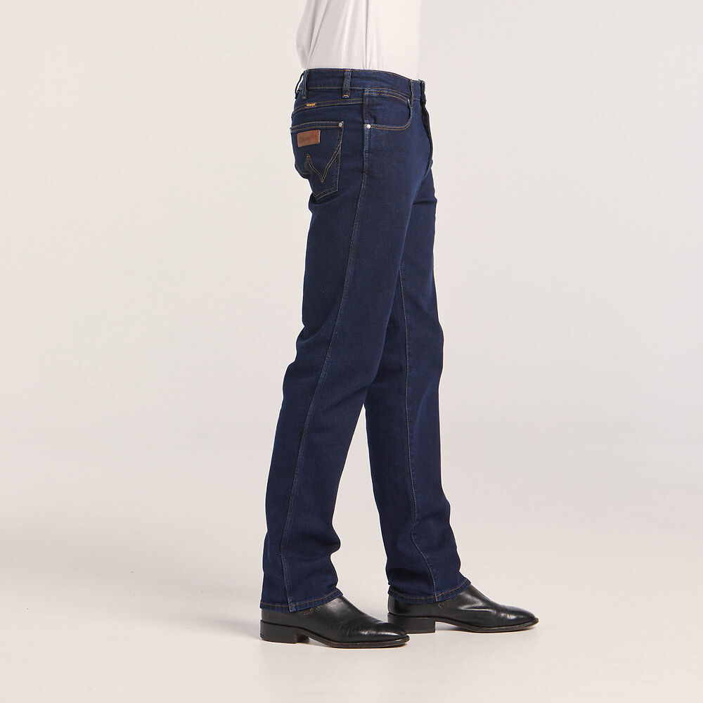 Stewarts Menswear Wrangler Classics straight Jeans. Colour is Original Rinse. Photo shows model wearing Wrangler jeans side view.