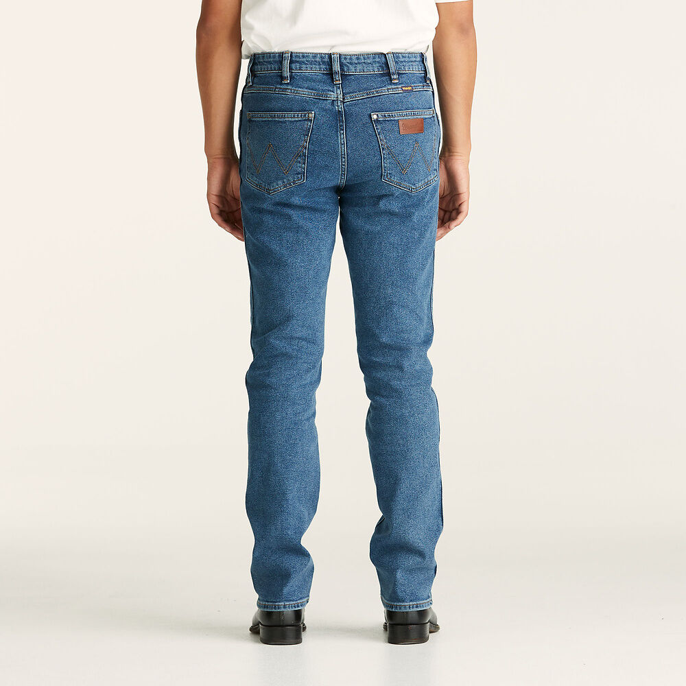 Stewarts Menswear Wrangler Classics Straight Jeans. Colour is Original Stone. Photo shows model wearing wrangler jeans back view.