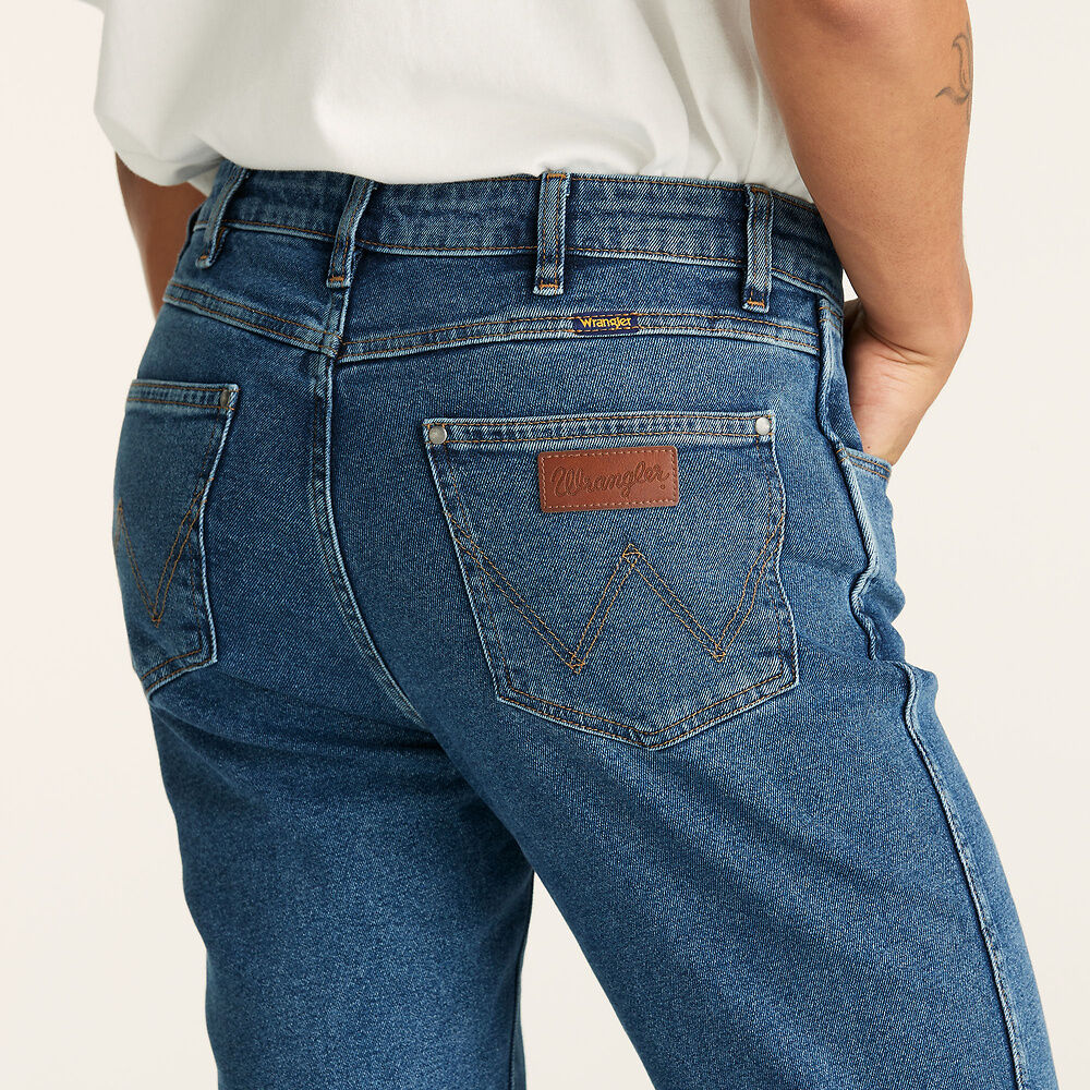 Stewarts Menswear Wrangler Classics Straight Jeans. Colour is Original Stone. Photo shows model wearing wrangler jeans close up back view.