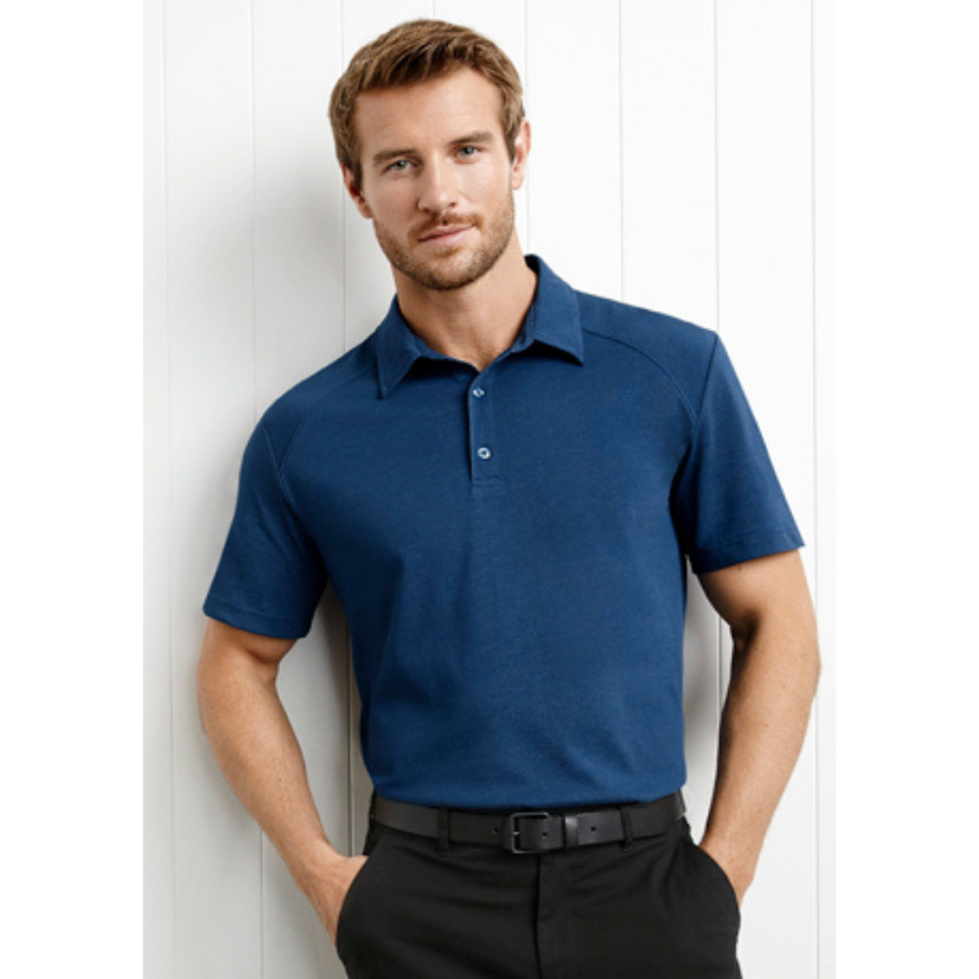 Stewart's Menswear Byron Polo Shirt, steel blue. The Byron Men's Polo Shirt from Fashion Biz is the perfect choice for a smart casual outfit! Made from a blend of 75% cotton and 25% polyester, this shirt is designed to keep you cool and comfortable.  The Cotton-rich jersey fabric provides a luxurious and comfortable feel against the skin and features a modern self-fabric collar and button placket.