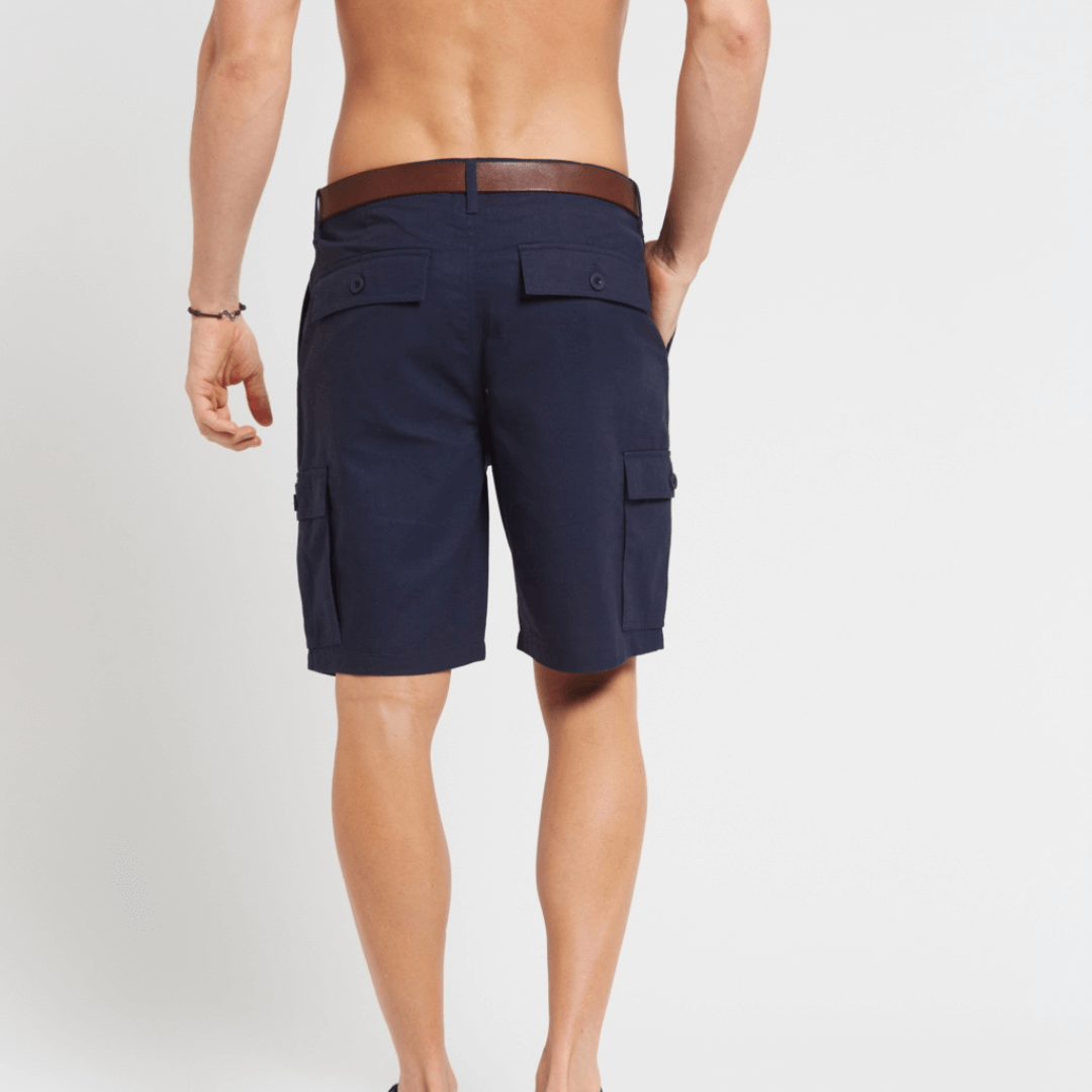 Male model wearing hemp/cotton Cargo shorts back view. Colour is Navy.