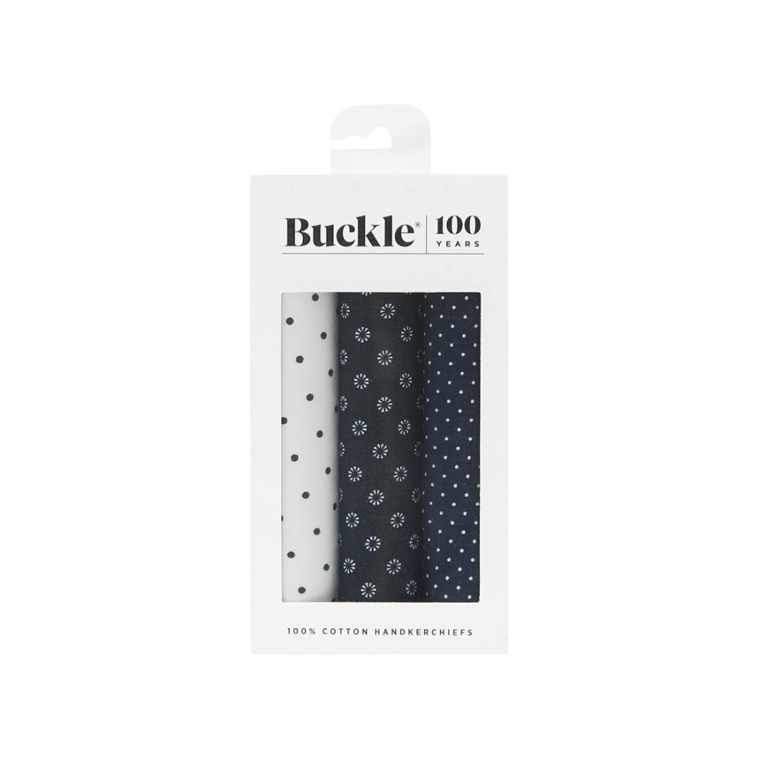 A gift box with 3 men's cotton hankies. 1 x white with navy spot, 1 x navy with white circle print, 1 x navy with white spot.