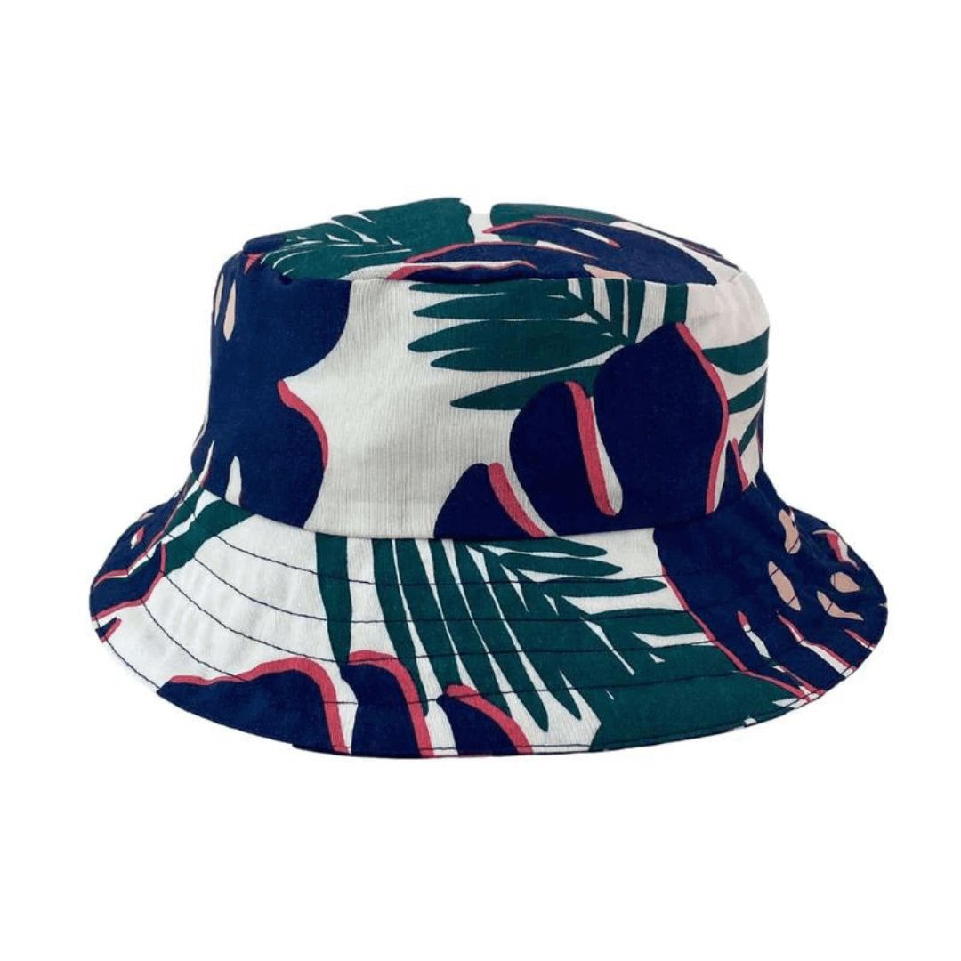 Stewarts Menswear Jimmy Stuart Australian made bucket hat MONSTERA. This Australian Made Bucket hat is made from high-quality cotton fabric. The ultimate Aussie year round essential. Perfect for a gift, hanging with your mates, chilling by the beach or a tropical getaway! Australian made. One size fits all. White background with green leaf and navy/pink monstera print.