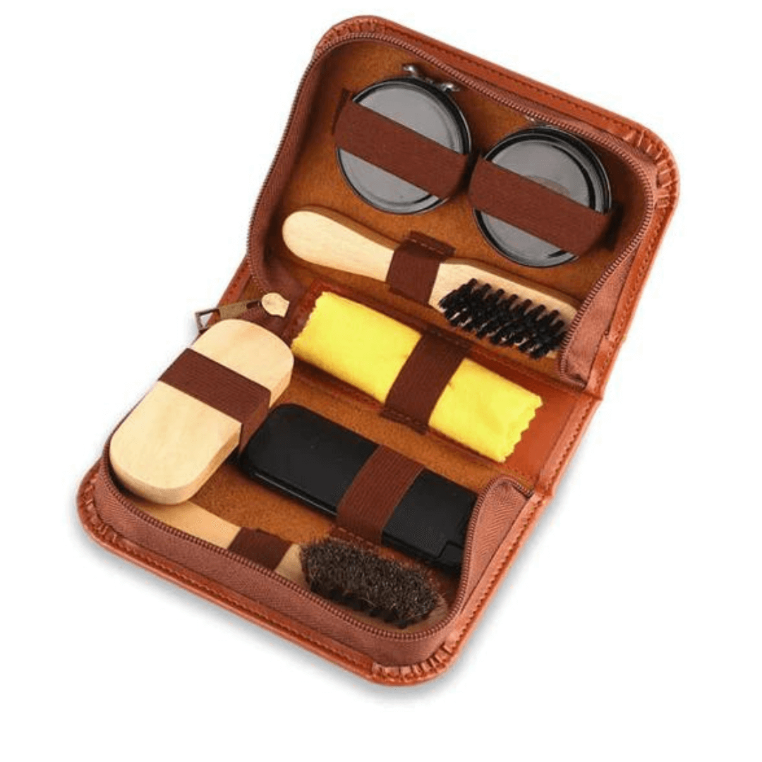 Stewarts Menswear men's gifts 7 piece shoe shine kit. Packed in a convenient faux leather zip case, these essential items will keep his shoes looking sharp wherever he goes.  Included in the kit:  • Black Shoe Wax • Neutral Shoe Wax • 3 Brushes • Lint Brush • Buff Cloth