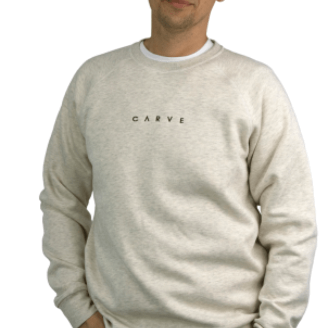 Brisk is a men's raglan sleeve crew neck fleece from Carve surf brand and is made with a 280gsm cotton-polyester blend, making it durable as well as warm.  A small understated centre embroidered chest logo finishes off this classic regular fit sweatshirt. Team with jeans, trackies or shorts for warmth on chilly days. Colourway is Oatmeal Marle with small chocolate coloured chest embroidered logo..