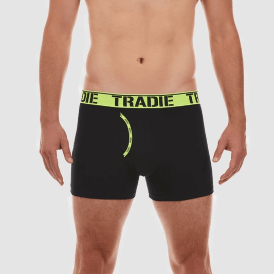 Stewart's Menswear Tradie man front trunk. Tradie Man Front Trunk is made from a blend of cotton and elastane, great for everyday wear.  The soft jacquard elastic waistband ensures a comfortable fit, while the working fly provides easy access.  The stretch cotton fabric is durable and designed to move with you. Model is wearing black trunks with fluoro yellow waistband and fly front trim.