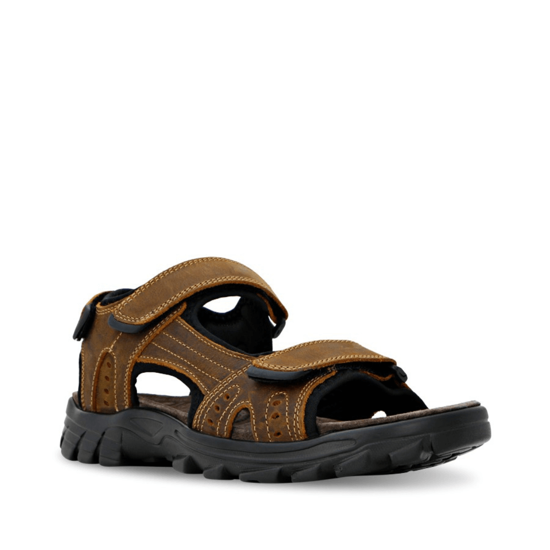 Stewart's Menswear Enrique sandals by Woodlands are the perfect everyday leather sandals for men. With adjustable straps, they fit any foot.    Features a leather upper and synthetic lining plus the padded insole will keep your feet feeling comfortable all day long. Front View