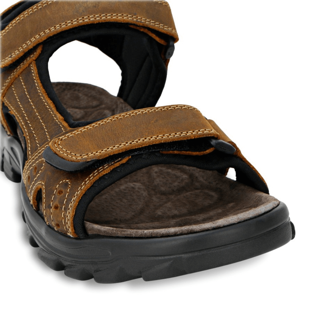 Stewart's Menswear Enrique sandals by Woodlands are the perfect everyday leather sandals for men. With adjustable straps, they fit any foot.    Features a leather upper and synthetic lining plus the padded insole will keep your feet feeling comfortable all day long. Close up view of padded sole.